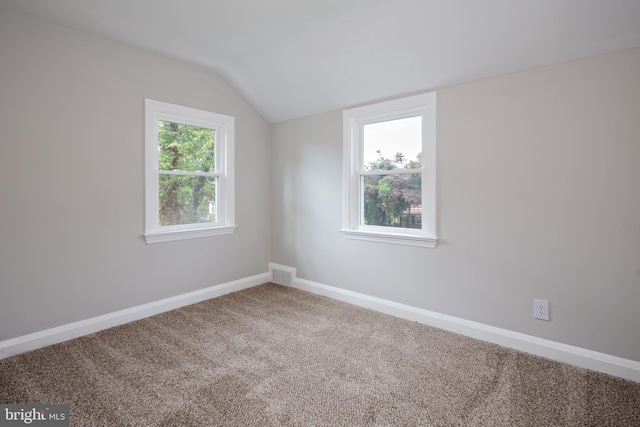 8207 Rockdale Ave, Baltimore, MD 21244 - carpeted spare room featuring vaulted ceiling and baseboards