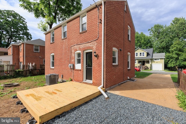 8207 Rockdale Ave, Baltimore, MD 21244 - rear view of property featuring brick siding and a wooden deck