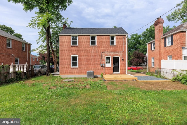 8207 Rockdale Ave, Baltimore, MD 21244 - back of property featuring a fenced backyard, a wooden deck, a chimney, and brick siding