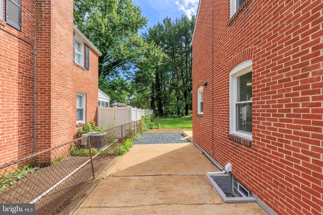 8207 Rockdale Ave, Baltimore, MD 21244 - view of side of property with brick siding and a patio area