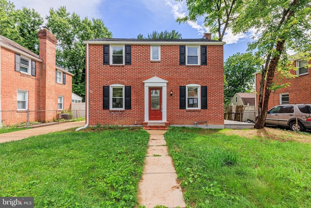 8207 Rockdale Ave, Baltimore, MD 21244 - colonial home with brick siding, entry steps, and a chimney