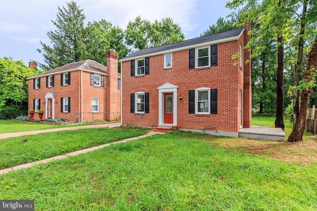 8207 Rockdale Ave, Baltimore, MD 21244 - colonial-style house featuring a front lawn, brick siding, and entry steps