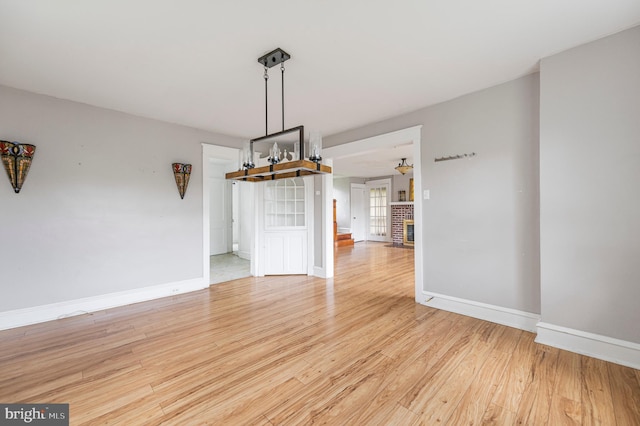 220 N Rolling Rd, Springfield, PA 19064 - unfurnished dining area with light wood-style flooring and baseboards