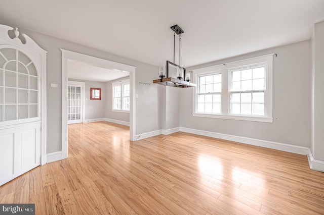 220 N Rolling Rd, Springfield, PA 19064 - unfurnished dining area with light wood-type flooring and baseboards