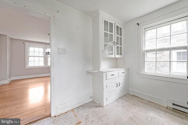 220 N Rolling Rd, Springfield, PA 19064 - unfurnished dining area with baseboards and baseboard heating
