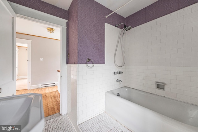 220 N Rolling Rd, Springfield, PA 19064 - bathroom with  shower combination, baseboard heating, tile walls, and wood finished floors