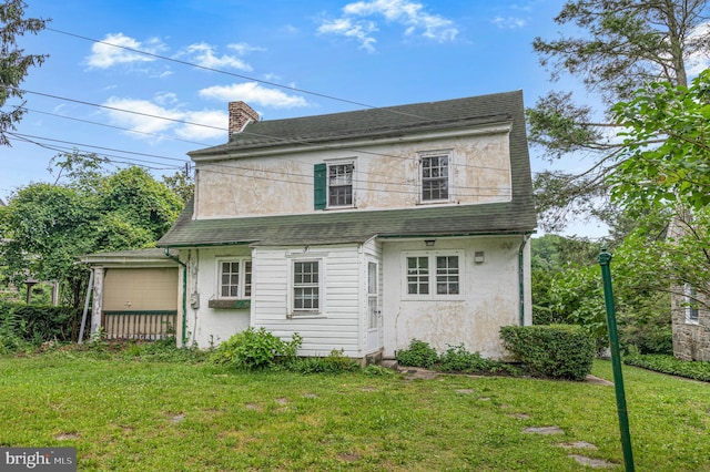 220 N Rolling Rd, Springfield, PA 19064 - rear view of property with a yard, a shingled roof, stucco siding, a chimney, and a garage