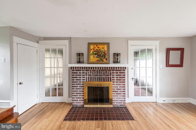 220 N Rolling Rd, Springfield, PA 19064 - unfurnished living room featuring wood finished floors and a brick fireplace