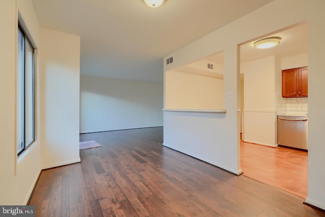 6988 Hanover Pkwy Unit 1, Greenbelt, MD 20770 - unfurnished room featuring wood finished floors and healthy amount of natural light