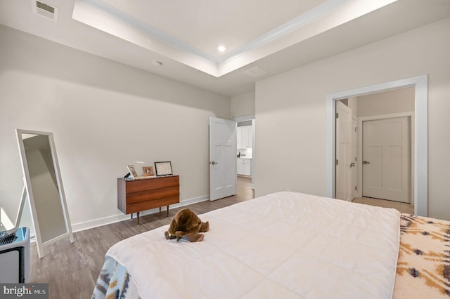 51 Old Forge Dr, Ocean View, DE 19970 - bedroom with wood finished floors, recessed lighting, and a tray ceiling