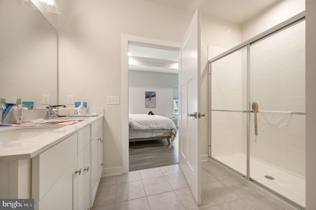 51 Old Forge Dr, Ocean View, DE 19970 - ensuite bathroom featuring double vanity, a stall shower, and tile patterned floors