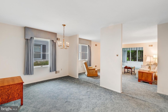 231 Valley Forge Dr, Little Egg Harbor Twp, NJ 08087 - unfurnished dining area with a chandelier and carpet flooring