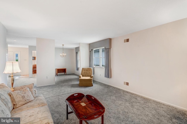 231 Valley Forge Dr, Little Egg Harbor Twp, NJ 08087 - carpeted living area featuring a chandelier and baseboards