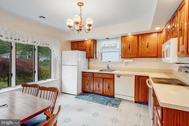 231 Valley Forge Dr, Little Egg Harbor Twp, NJ 08087 - kitchen featuring white appliances, brown cabinets, a chandelier, light countertops, and recessed lighting