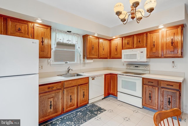 231 Valley Forge Dr, Little Egg Harbor Twp, NJ 08087 - kitchen featuring white appliances, a chandelier, brown cabinets, and recessed lighting