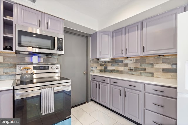 31 Gallaway Ln, Willingboro, NJ 08046 - kitchen featuring appliances with stainless steel finishes, gray cabinets, light countertops, and decorative backsplash