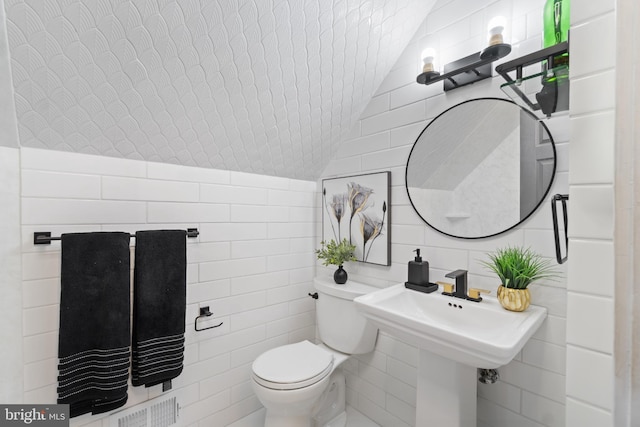 31 Gallaway Ln, Willingboro, NJ 08046 - half bath featuring tile walls and vaulted ceiling