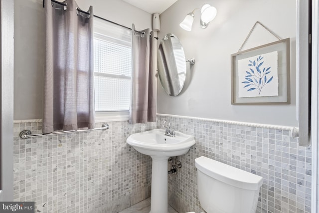 31 Gallaway Ln, Willingboro, NJ 08046 - half bathroom featuring a wainscoted wall and tile walls