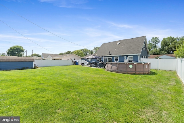 31 Gallaway Ln, Willingboro, NJ 08046 - rear view of house with a fenced backyard and roof with shingles