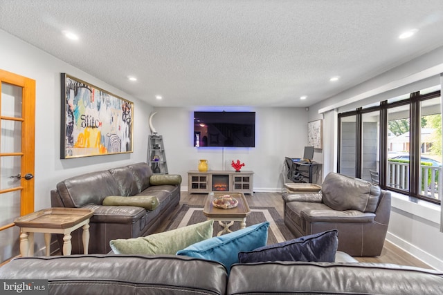 31 Gallaway Ln, Willingboro, NJ 08046 - living room with wood finished floors, recessed lighting, and a textured ceiling