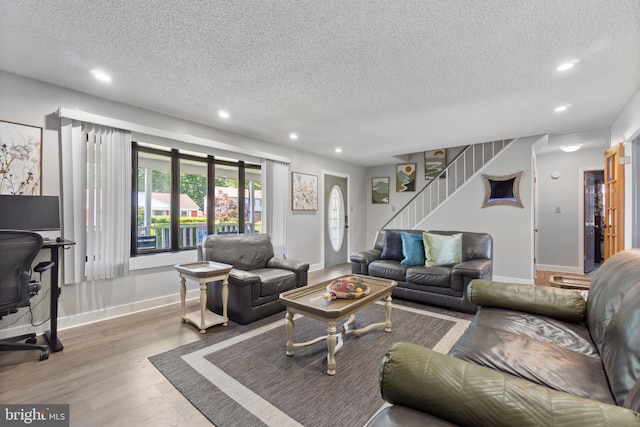 31 Gallaway Ln, Willingboro, NJ 08046 - living area featuring a textured ceiling, recessed lighting, wood finished floors, and stairs