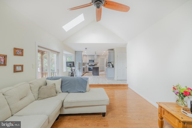 1439 Millikens Bend Rd, Herndon, VA 20170 - living area with a ceiling fan, light wood-style floors, high vaulted ceiling, and a skylight
