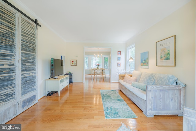 1439 Millikens Bend Rd, Herndon, VA 20170 - living area with a chandelier, crown molding, light wood-style floors, and a barn door