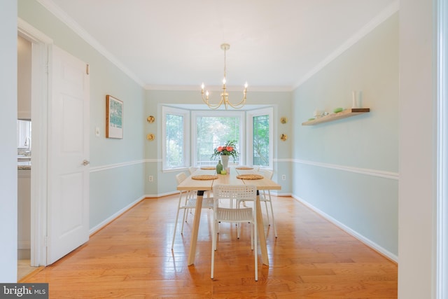 1439 Millikens Bend Rd, Herndon, VA 20170 - dining space with a chandelier, light wood finished floors, and crown molding