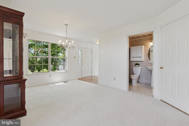 2408 Carriage Ln, Royersford, PA 19468 - spare room featuring a chandelier and carpet flooring