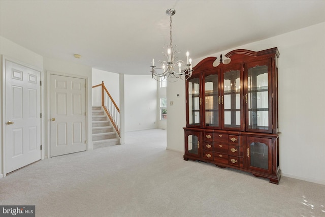 2408 Carriage Ln, Royersford, PA 19468 - unfurnished dining area featuring carpet flooring, a chandelier, and stairs