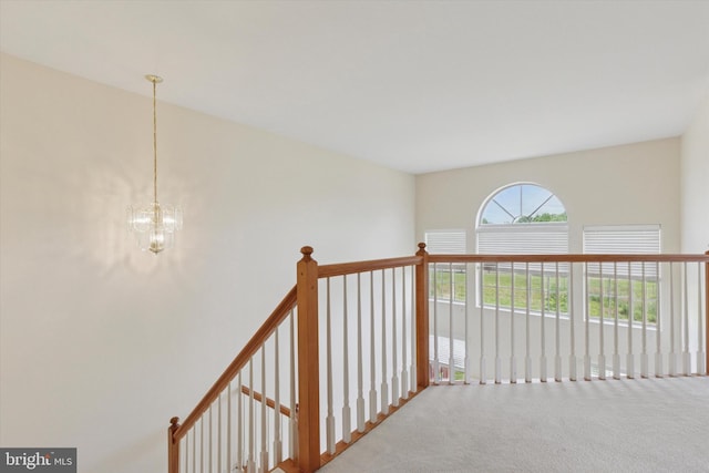 2408 Carriage Ln, Royersford, PA 19468 - corridor featuring carpet floors, a chandelier, and an upstairs landing