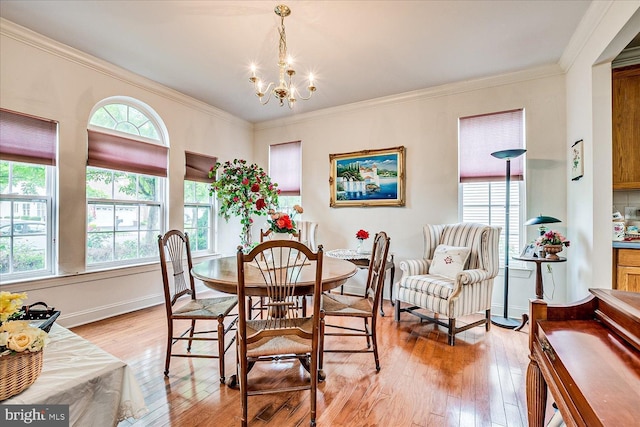 16 Monte Carlo Dr, Hamilton, NJ 08691 - dining space featuring light wood-type flooring, a chandelier, and crown molding