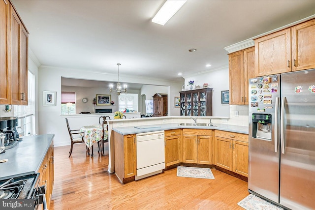 16 Monte Carlo Dr, Hamilton, NJ 08691 - kitchen with stainless steel refrigerator with ice dispenser, white dishwasher, ornamental molding, a peninsula, and light wood-type flooring