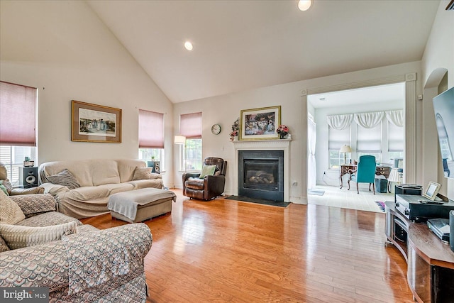 16 Monte Carlo Dr, Hamilton, NJ 08691 - living room featuring wood finished floors, high vaulted ceiling, a fireplace with flush hearth, and recessed lighting