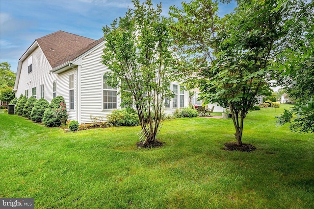 16 Monte Carlo Dr, Hamilton, NJ 08691 - view of side of home with a lawn and a shingled roof