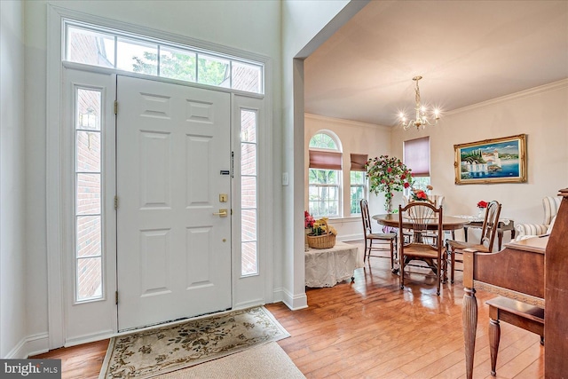 16 Monte Carlo Dr, Hamilton, NJ 08691 - entryway featuring a chandelier, light wood finished floors, and ornamental molding