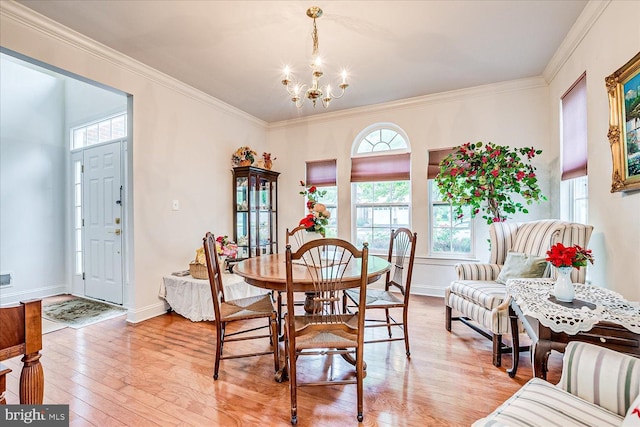 16 Monte Carlo Dr, Hamilton, NJ 08691 - dining space with a chandelier, healthy amount of natural light, light wood-style flooring, and ornamental molding