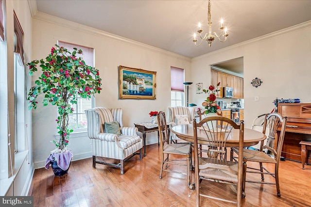 16 Monte Carlo Dr, Hamilton, NJ 08691 - dining space with a chandelier, light wood-type flooring, and crown molding