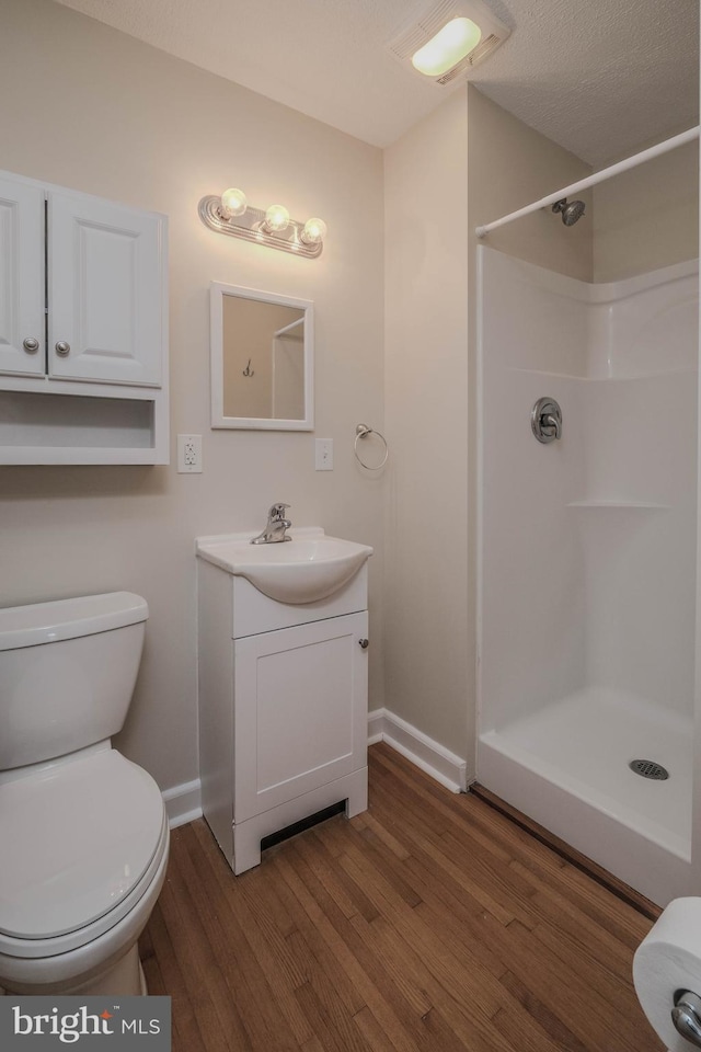 830 William St, Front Royal, VA 22630 - bathroom featuring wood finished floors, vanity, and a shower