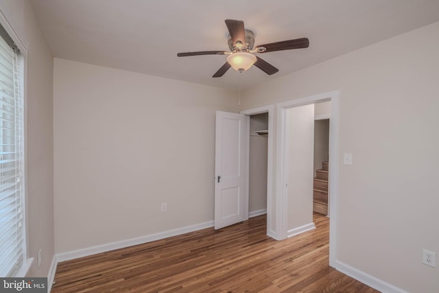 830 William St, Front Royal, VA 22630 - unfurnished bedroom with wood finished floors, a ceiling fan, and a closet