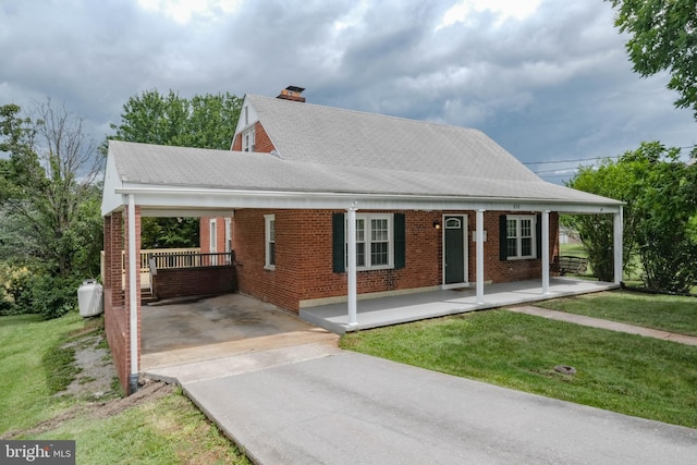 830 William St, Front Royal, VA 22630 - view of front of house with covered porch, brick siding, driveway, and a chimney
