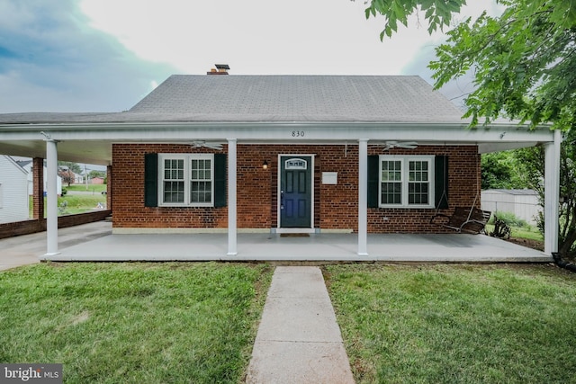 830 William St, Front Royal, VA 22630 - view of front of home featuring ceiling fan, brick siding, covered porch, and a chimney