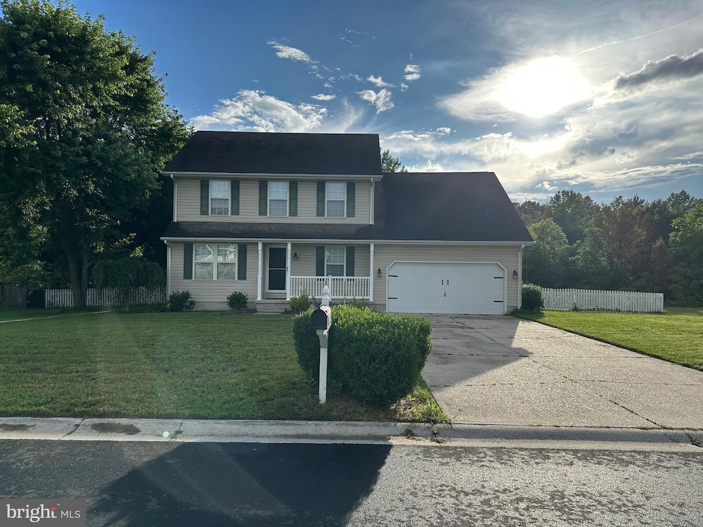114 Acorn Forest Dr, Felton, DE 19943 - view of front of home featuring covered porch, concrete driveway, and a garage