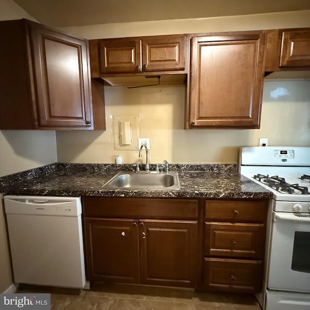 5565 Columbia Pike Unit 210, Arlington, VA 22204 - kitchen featuring white appliances and dark stone countertops