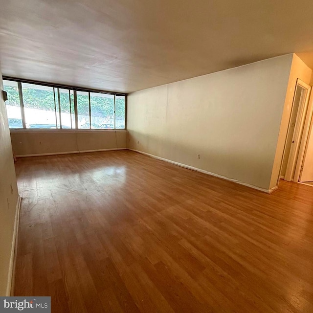 5565 Columbia Pike Unit 210, Arlington, VA 22204 - spare room featuring wood finished floors and baseboards