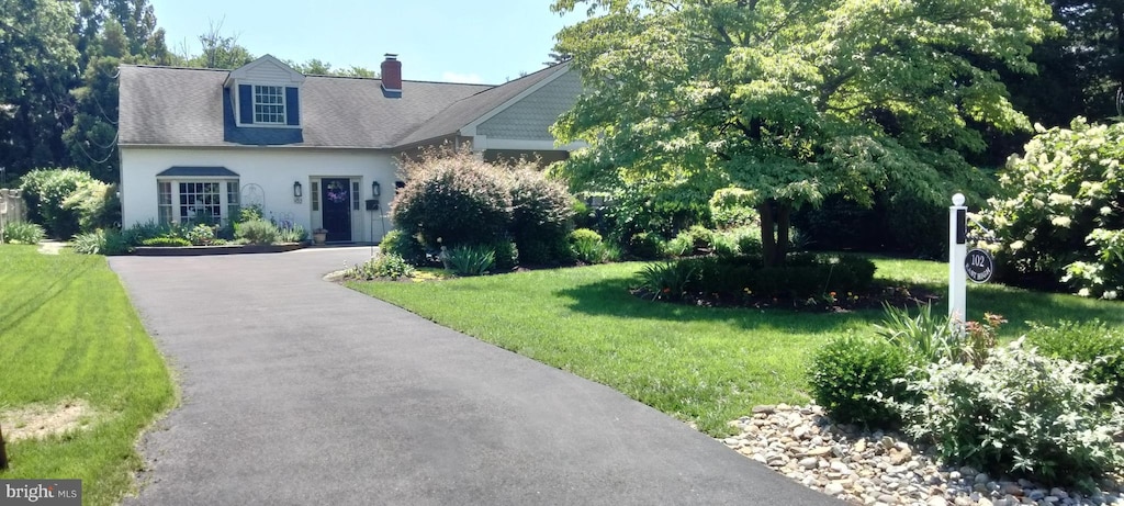 102 E High St, Haddon Heights, NJ 08035 - view of front facade featuring a front lawn, a chimney, and asphalt driveway