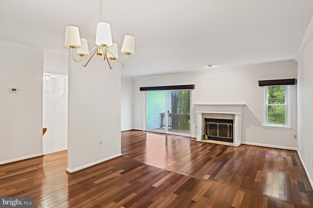 9405 Odyssey Ct, Burke, VA 22015 - unfurnished living room with hardwood / wood-style floors, crown molding, a chandelier, and a fireplace