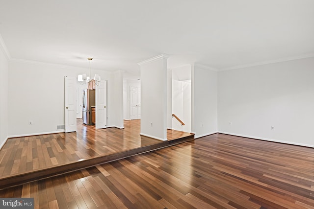 9405 Odyssey Ct, Burke, VA 22015 - spare room featuring hardwood / wood-style floors, ornamental molding, and a chandelier