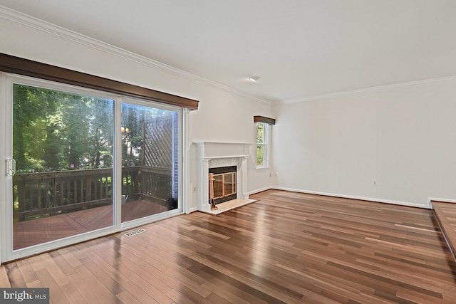 9405 Odyssey Ct, Burke, VA 22015 - unfurnished living room with wood finished floors, crown molding, and a high end fireplace