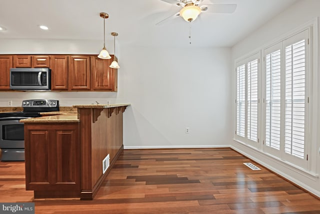 9405 Odyssey Ct, Burke, VA 22015 - kitchen with appliances with stainless steel finishes, healthy amount of natural light, wood finished floors, and recessed lighting